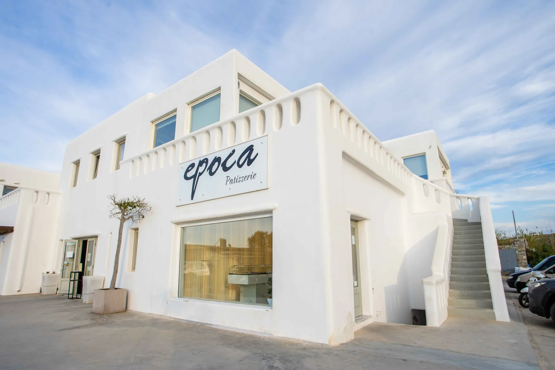 Whitewashed storefront of Epoca Patisserie in Mykonos